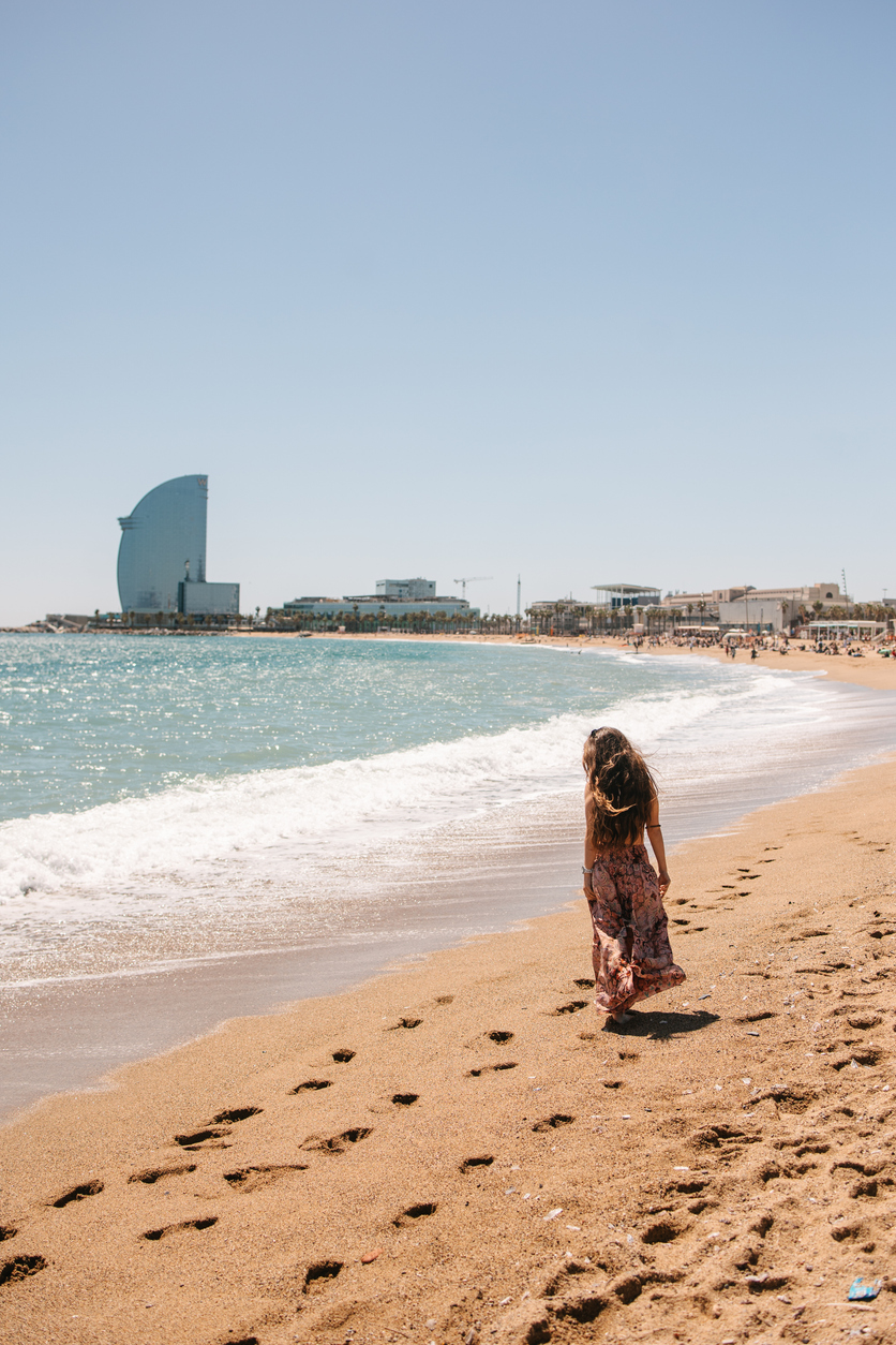 Woman walking by the sea