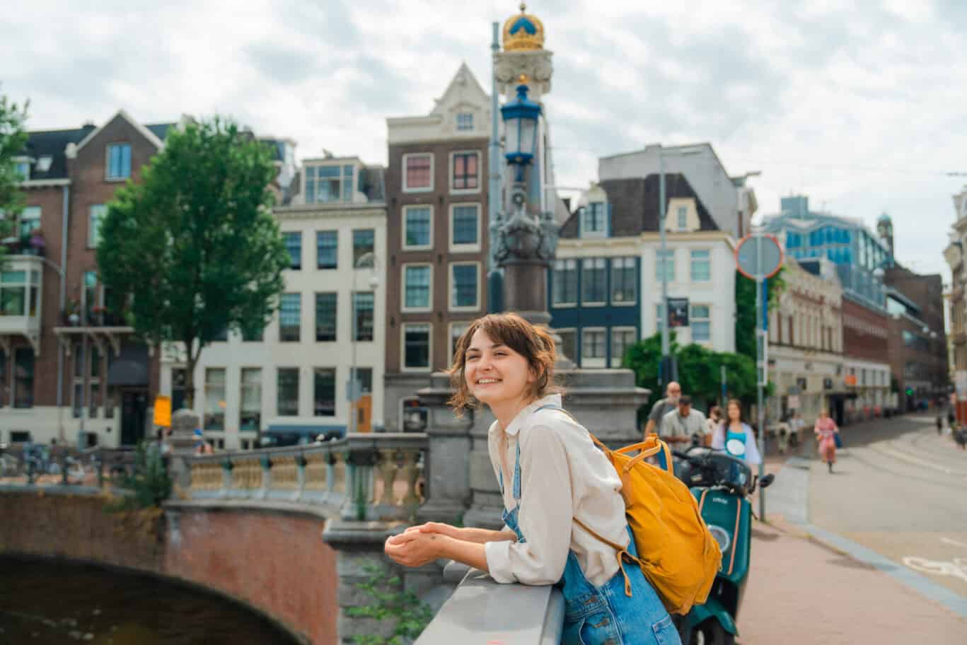 Cheerful woman walking in Amsterdam in summer