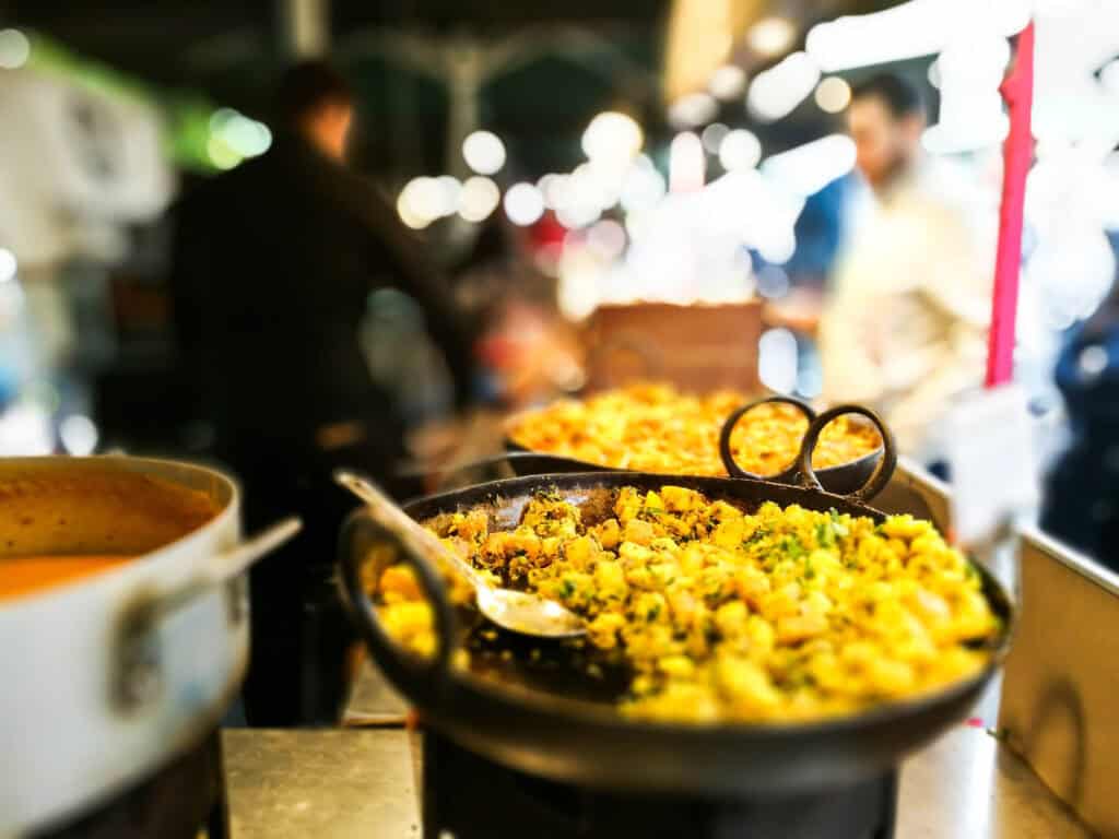 Vibrant street food stall at Mitte Hostel, Berlin, offering local and international dishes.