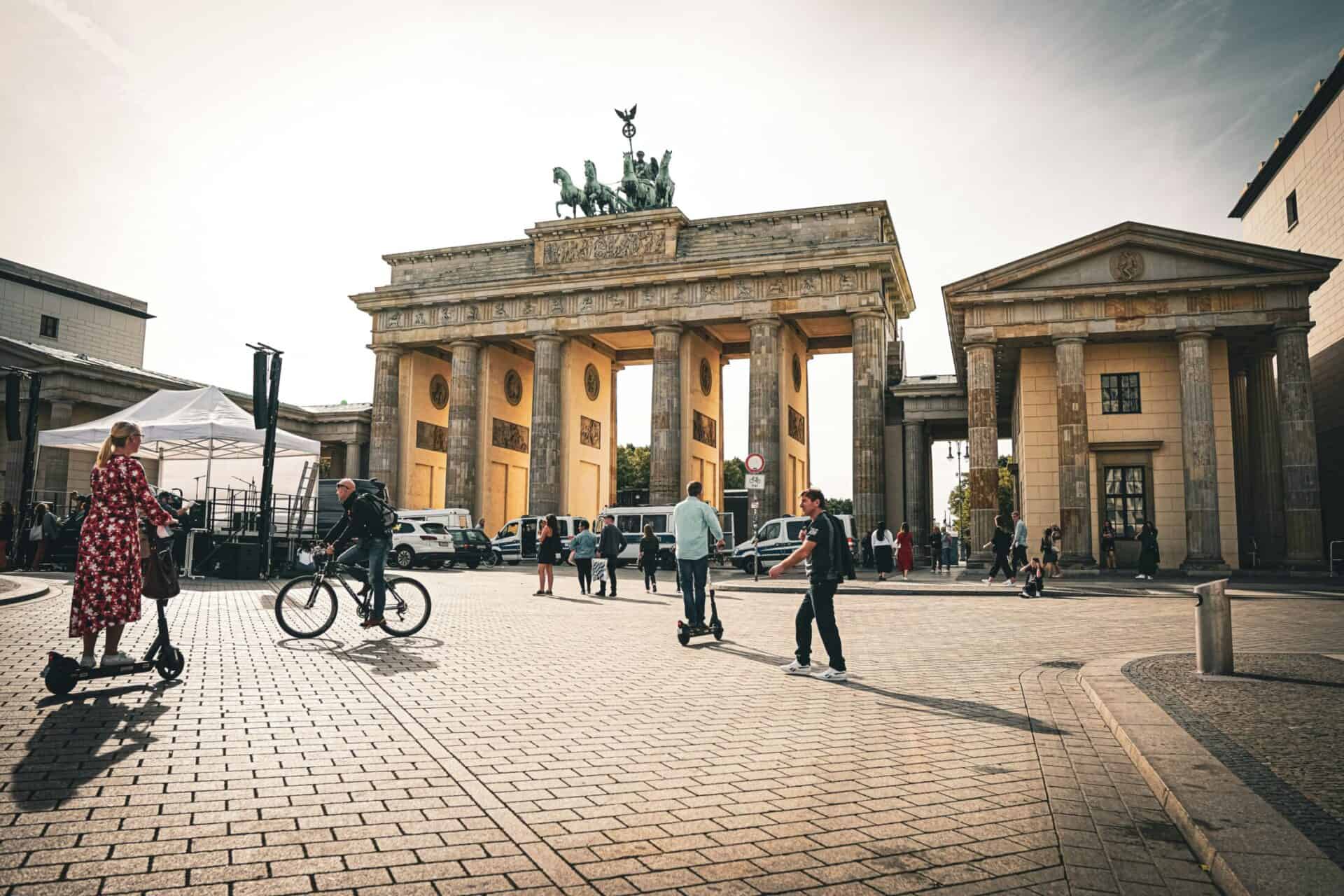 Brandenburg Gate in Berlin with visitors and tourists, showcasing the historic landmark and vibrant.