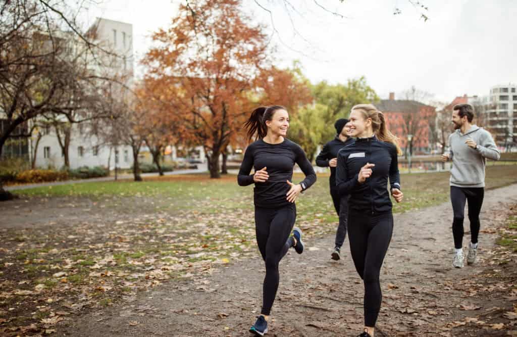 Outdoor running scene at St Christopher’s Berlin - Mitte hostel, featuring young people jogging in a.