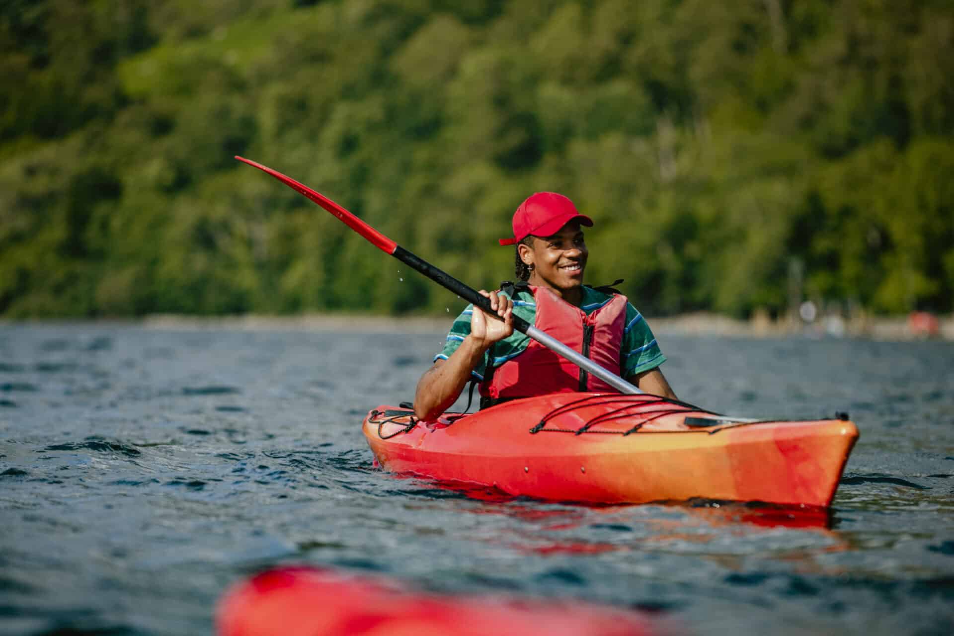 Kayaking on the river near St Christopher’s Berlin - Mitte hostel, showcasing outdoor activities in.