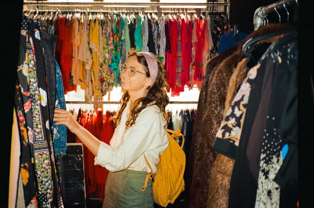 Young woman shopping at a clothing store in Mitte, Berlin.