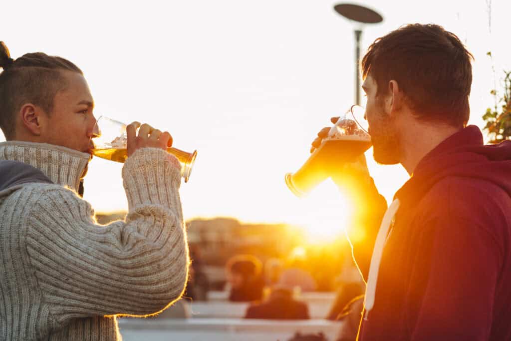 Enjoy drinks with friends at St Christopher’s Berlin - Mitte during sunset.