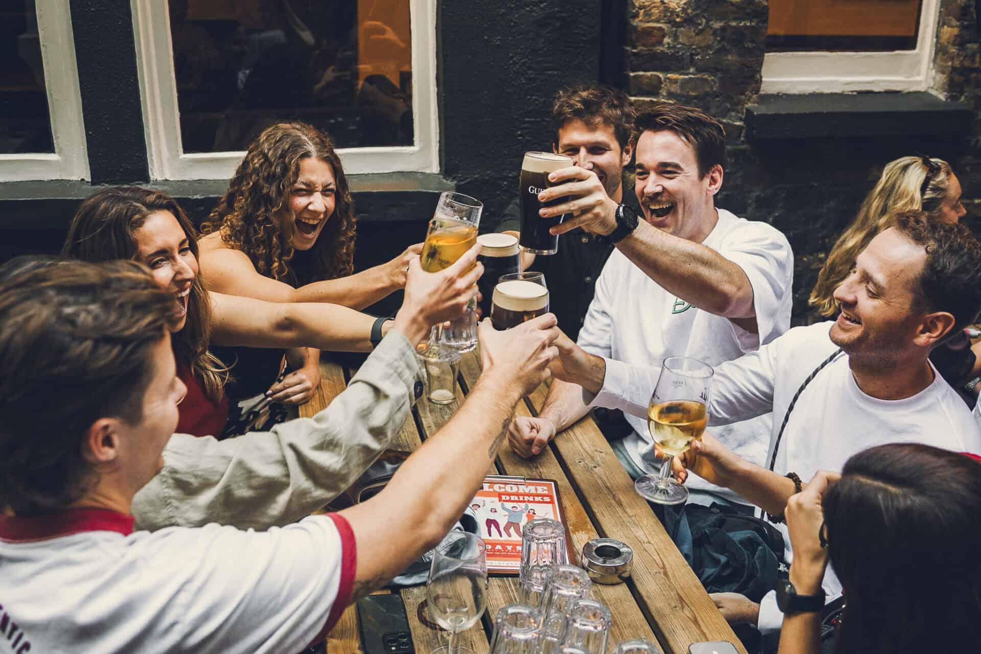 Hostel guests enjoying drinks in the outdoor seating area at St Christopher's Pub, London Bridge.