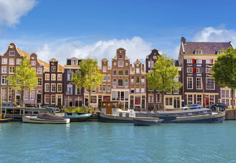 Historic gabled houses along Singel canal in Amsterdam