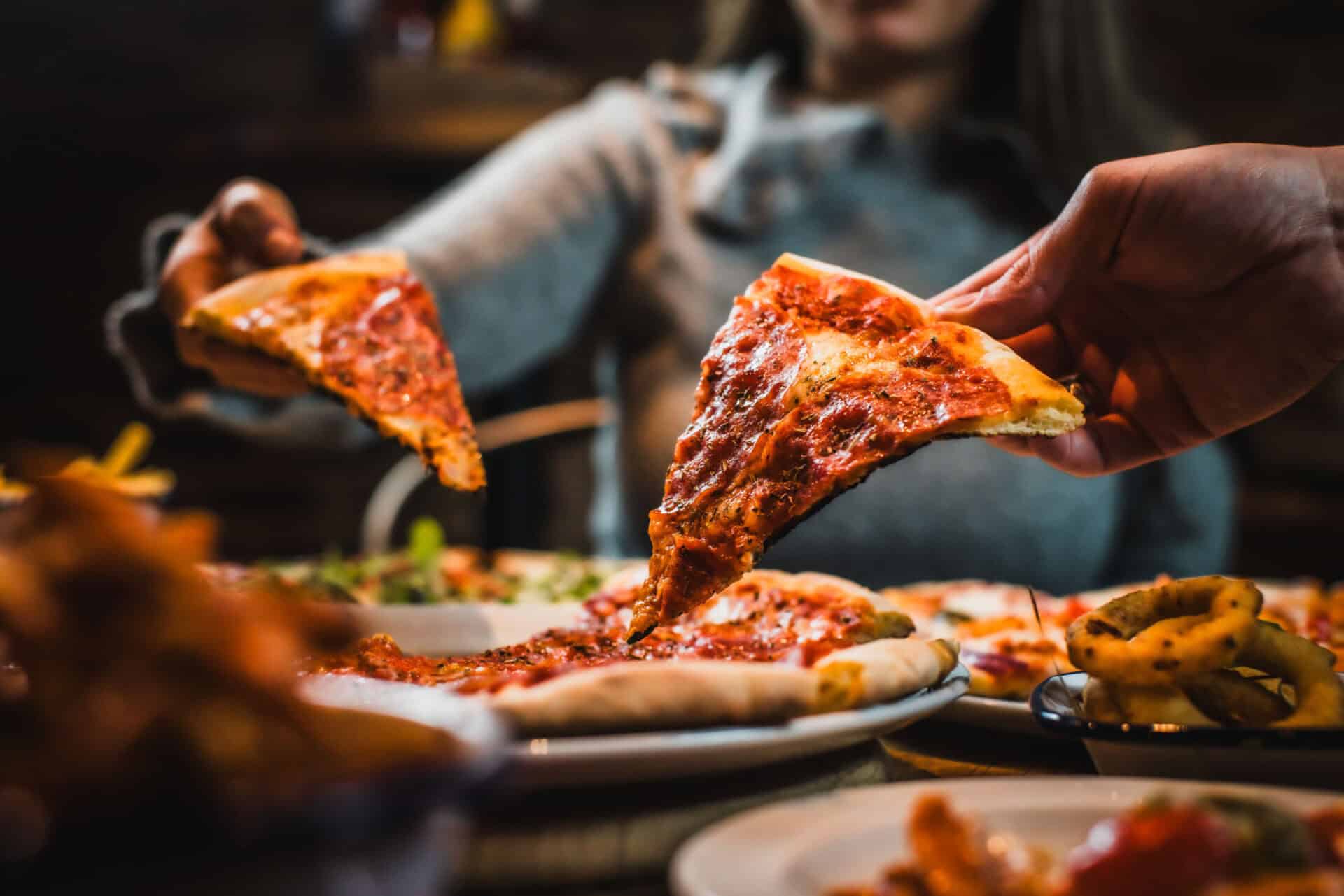 Pizza being served at St Christopher's restaurant, showcasing delicious Italian cuisine.