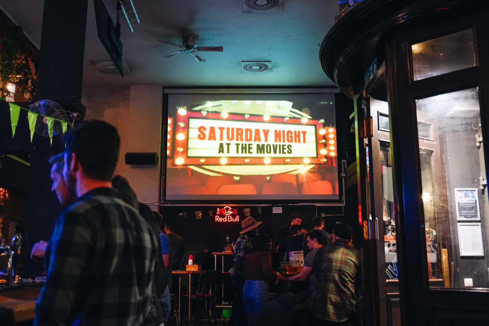 Cinema night at St Christopher's pub with drinks, socialising, and entertainment.